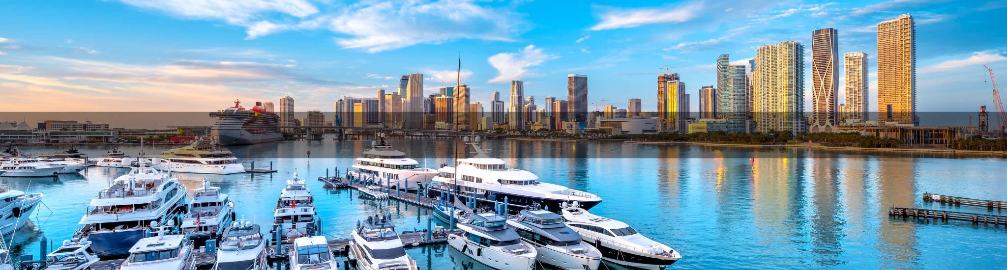 view of miami skyline and boats in ocean